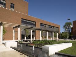 The grass, trees, fountains, and sitting areas directly in front of the Grace Jacobs Building on the Coppin State University campus.