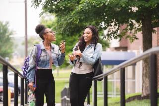 two students talking outside